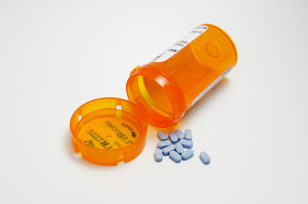 Prescription Bottle And Blue Pills